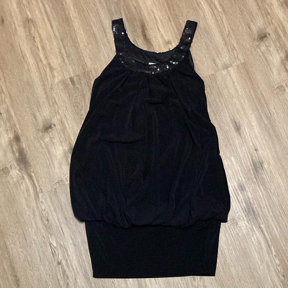 Black dress with the sparkly sequins around the neck